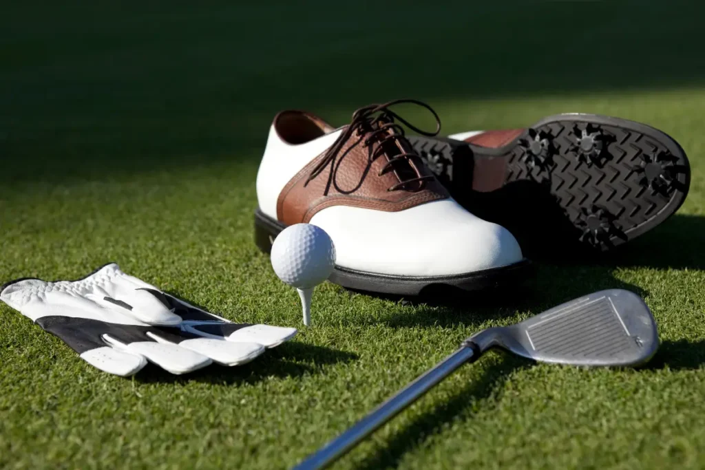 golf shoes placed on the golf park.